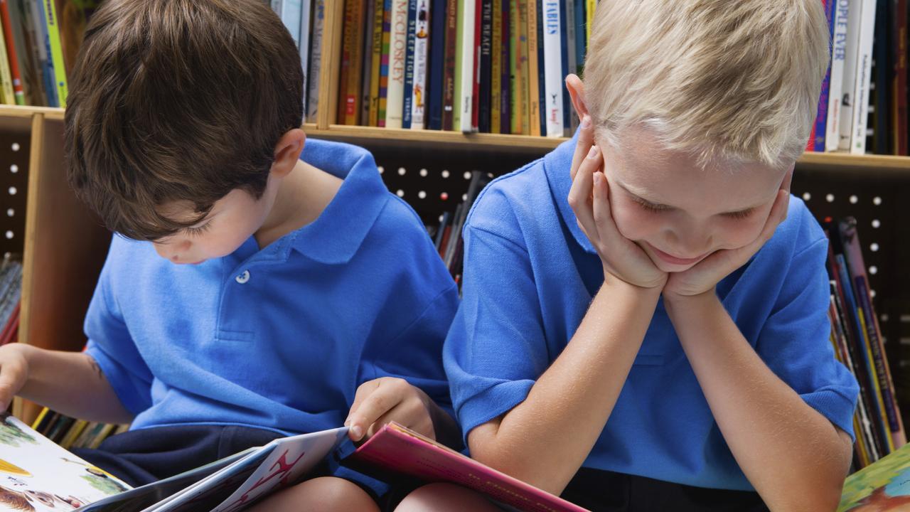 school boys reading book